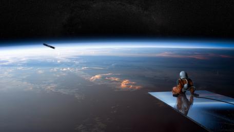 Lone Astronaut Above Earth’s Horizon wallpaper