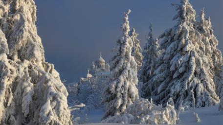 Snow Covered Belogorsk Monastery in Winter Glow wallpaper