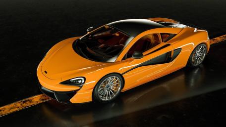 Orange McLaren 570S on Dark Road wallpaper