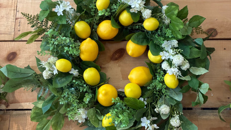 Lemon Blossom Wreath on Rustic Wood wallpaper