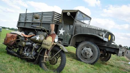 WWII Military Motorcycle and Army Truck Display wallpaper