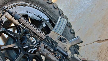 Gray Tactical Rifle on Winter Wheel wallpaper