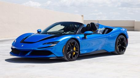Blue Ferrari SF90 Spider On Rooftop wallpaper