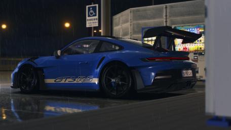 Dynamic Porsche 911 GT3 RS in Rainy Night Setting wallpaper