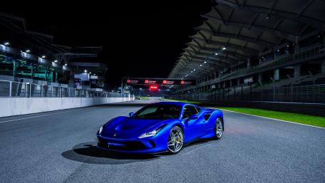 Blue Ferrari F8 Tributo Under Night Lights wallpaper