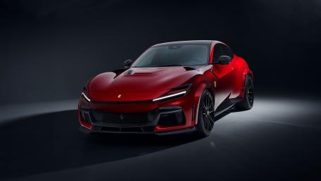 Red Ferrari Purosangue in Studio Light wallpaper