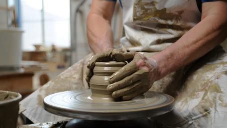 Hands Shaping Clay on the Potter Wheel wallpaper