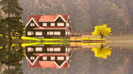Tranquil Lakeside Cottage in Autumn Glory wallpaper