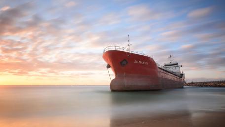 Cargo Ship at Sunset wallpaper