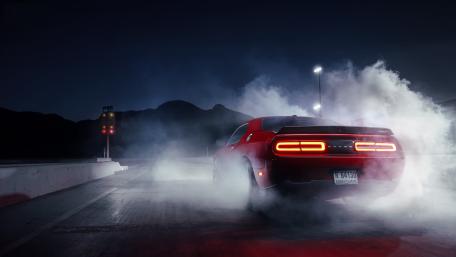 Red Dodge Challenger Burning Through Night Smoke wallpaper