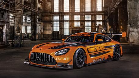 Orange Mercedes AMG GT3 in Industrial Hangar wallpaper