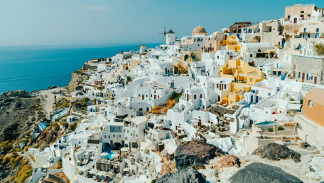 Sunlit White Cliffs of Oia wallpaper