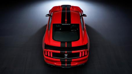 Red Shelby Mustang Under Dramatic Spotlight wallpaper