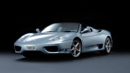 Silver Ferrari 360 Spider on Black Stage wallpaper