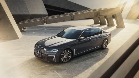 BMW 740Li M Sport in Modern Architectural Setting wallpaper