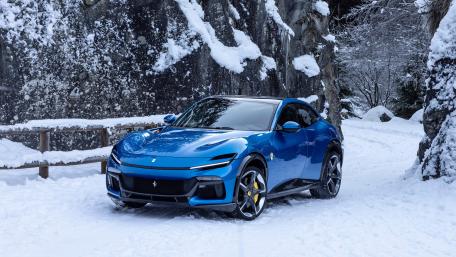 Ferrari Purosangue in Snowy Alpine Luxury wallpaper