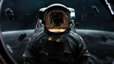 Skull of a dead astronaut with a cracked helmet wallpaper