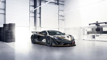 McLaren 570S GT4 in Pristine Racing Garage wallpaper