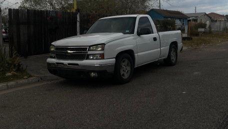 Classic White Pickup Truck on a Quiet Street wallpaper
