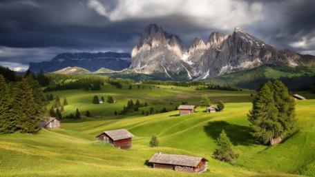 Alpine Meadows Beneath Dramatic Dolomites wallpaper