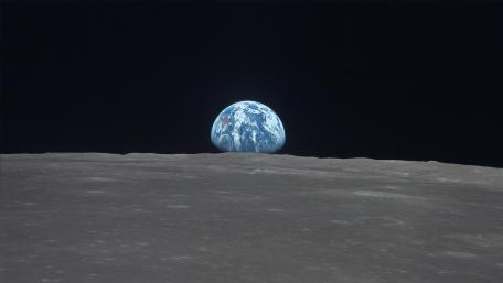 Earthrise Over Silent Lunar Horizon wallpaper