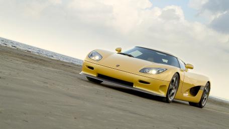 Yellow Porsche Carrera GT on the Shoreline wallpaper