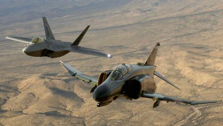 F-4 Phantom II and F-22 Raptor in Flight wallpaper