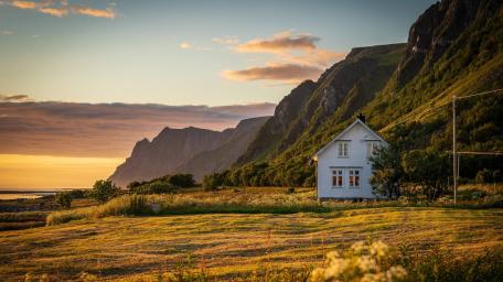 Golden Cottage Beneath Andøya Cliffs wallpaper