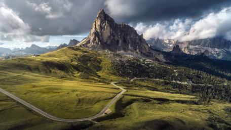 Dolomite Peaks Under Stormy Skies wallpaper
