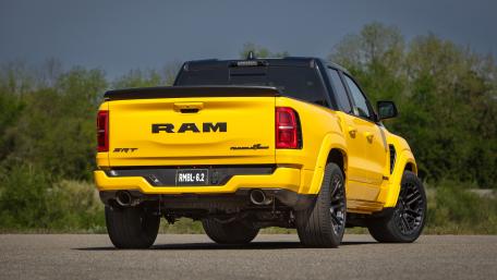 Bold Yellow Ram Pickup on Open Road wallpaper