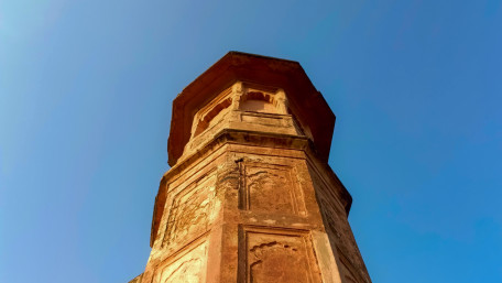 Ancient Tower Rising Above Blue Sky wallpaper
