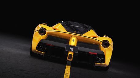 Yellow Ferrari LaFerrari Aperta on Dark Road wallpaper