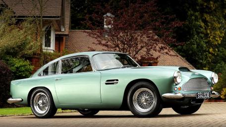 Elegant Aston Martin DB4 in Mint Green wallpaper
