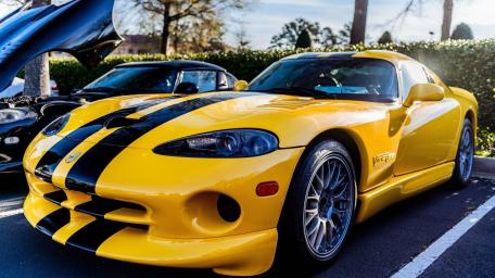 Yellow Dodge Viper with Striking Racing Stripes wallpaper