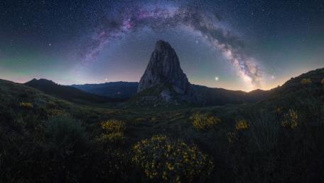 Celestial Arch Over Silent Peak wallpaper