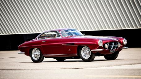 Classic Jaguar XK120 in Elegant Motion wallpaper