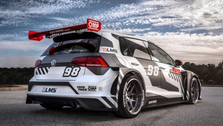 Racing Volkswagen Golf Under Dramatic Sky wallpaper