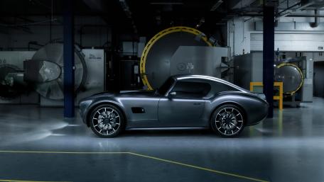 Sleek Black Cobra in Industrial Glow wallpaper