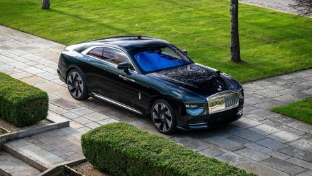 Rolls Royce Spectre in Elegant Garden Setting wallpaper