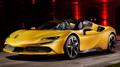 Golden Ferrari SF90 Spider at Night wallpaper