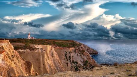 Cape Espichel Lighthouse Above Dramatic Atlantic Cliffs wallpaper