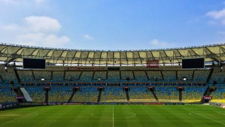 Sunlit Soccer Stadium Panorama wallpaper