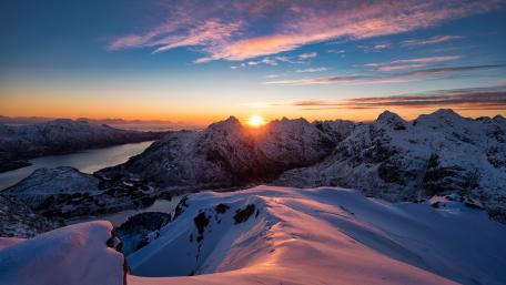 Alpine Sunrise Over Snowy Peaks wallpaper