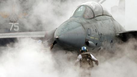 Fighter Jet in Smoke Filled Hangar wallpaper