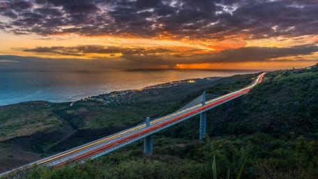 Sunset Highway Over Coastal Bridge wallpaper