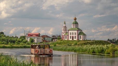 Peaceful River Journey by Suzdal Church wallpaper