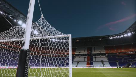 Empty Stadium Goal Under Bright Evening Lights wallpaper