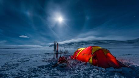 Moonlit Arctic Camp Under Winter Skies wallpaper