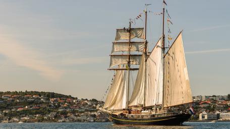 Majestic Tall Ship at Golden Harbor Sunset wallpaper