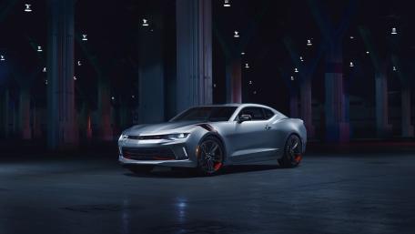 Silver Camaro Under Neon Shadows wallpaper